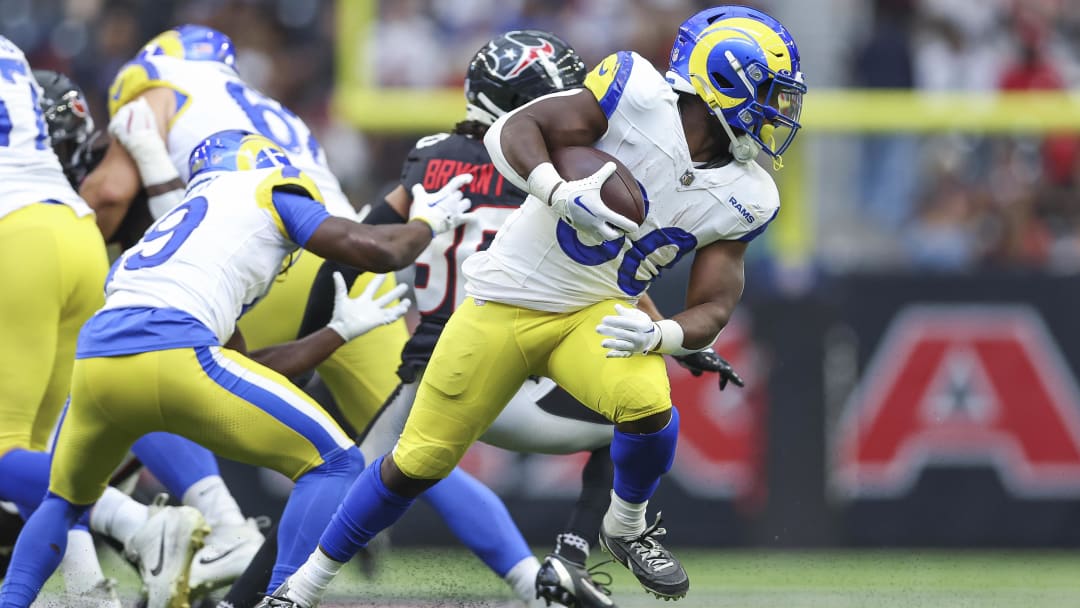 Aug 24, 2024; Houston, Texas, USA; Los Angeles Rams running back Boston Scott (30) spins and runs with the ball during the first quarter against the Houston Texans at NRG Stadium. Mandatory Credit: Troy Taormina-USA TODAY Sports