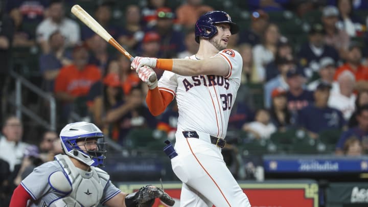 Apr 3, 2024; Houston, Texas, USA; Houston Astros right fielder Kyle Tucker (30) hits a single during the first inning against the Toronto Blue Jays at Minute Maid Park.