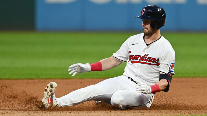 Aug 1, 2024; Cleveland, Ohio, USA; Cleveland Guardians center fielder Lane Thomas (8) slides into second with a double during the seventh inning against the Baltimore Orioles at Progressive Field. Mandatory Credit: Ken Blaze-USA TODAY Sports