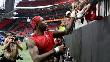 Dec 22, 2019; Atlanta, Georgia, USA; Atlanta Falcons wide receiver Julio Jones (11) signs autographs for fans after they defeated the Jacksonville Jaguars at Mercedes-Benz Stadium. Mandatory Credit: Jason Getz-Imagn Images