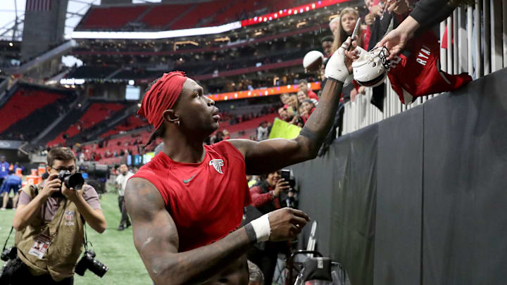 Dec 22, 2019; Atlanta, Georgia, USA; Atlanta Falcons wide receiver Julio Jones (11) signs autographs for fans after they defeated the Jacksonville Jaguars at Mercedes-Benz Stadium. Mandatory Credit: Jason Getz-Imagn Images