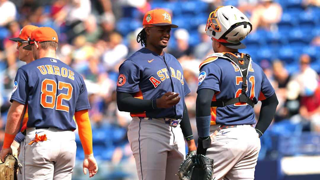 Mar 1, 2026; Port St. Lucie, Florida, USA;  Houston Astros pitcher Alimber Santa (75) talks to catcher Yainer Diaz.