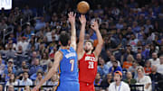 Oct 21, 2025; Oklahoma City, Oklahoma, USA; Houston Rockets center Alperen Sengun (28) shoots over Oklahoma City Thunder center Chet Holmgren (7) during the second half at Paycom Center. Mandatory Credit: Alonzo Adams-Imagn Images