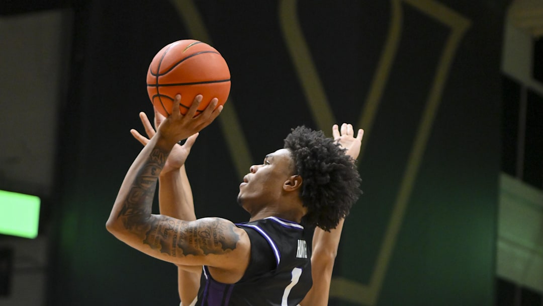 Dec 13, 2025; Nashville, Tennessee, USA;  Central Arkansas Bears guard Camren Hunter (1) shoots over Vanderbilt Commodores forward Tyler Nickel (5) during the first half at Memorial Gymnasium. Mandatory Credit: Steve Roberts-Imagn Images