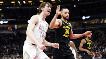 Feb 8, 2025; Chicago, Illinois, USA; Chicago Bulls forward Matas Buzelis (14) reacts after a basket against Golden State Warriors guard Stephen Curry (30) during the second half at United Center. Mandatory Credit: David Banks-Imagn Images
