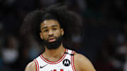 Apr 6, 2025; Charlotte, North Carolina, USA; Chicago Bulls guard Coby White (0) stands on the court during the first quarter against the Charlotte Hornets at Spectrum Center. Mandatory Credit: Nell Redmond-Imagn Images