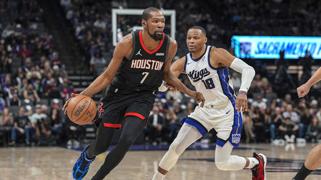 Jan 11, 2026; Sacramento, California, USA; Houston Rockets forward Kevin Durant (7) dribbles against Sacramento Kings guard Russell Westbrook (18) during the fourth quarter at Golden 1 Center. Mandatory Credit: Justine Willard-Imagn Images