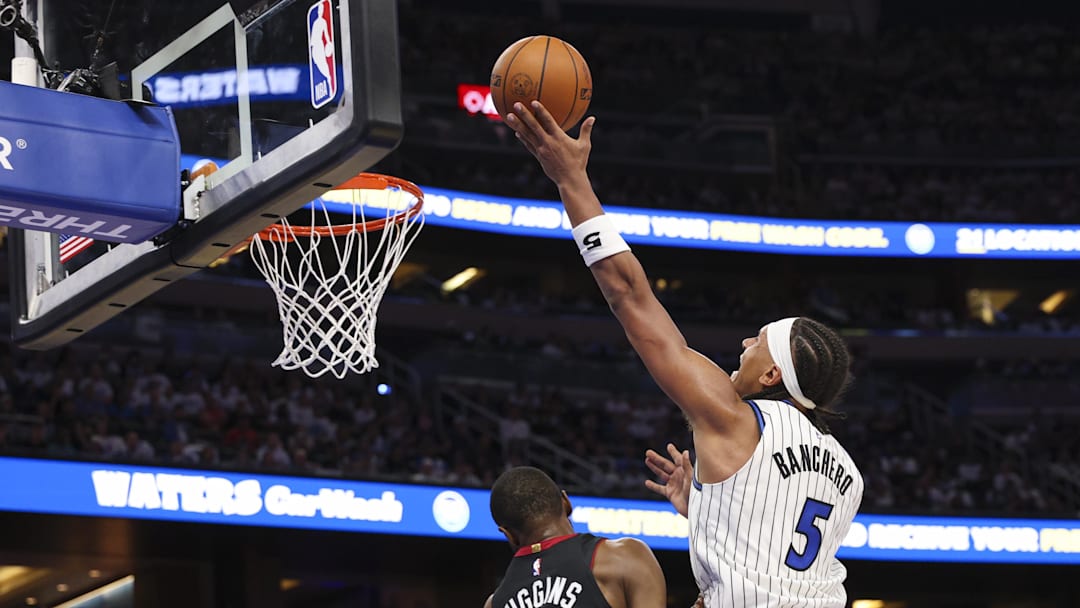 Oct 22, 2025; Orlando, Florida, USA; Orlando Magic forward Paolo Banchero (5) drives to the basket against the Miami Heat in the third quarter at Kia Center. Mandatory Credit: Nathan Ray Seebeck-Imagn Images