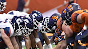 Sep 22, 2018; Syracuse, NY, USA; The Connecticut Huskies and Syracuse Orange line up against each other for an extra point during the fourth quarter at the Carrier Dome. Mandatory Credit: Mark Konezny-Imagn Images