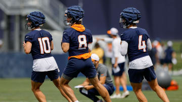 Jul 26, 2024; Englewood, CO, USA; Denver Broncos quarterback Bo Nix (10) and quarterback Jarrett Stidham (8) and quarterback Zach Wilson (4) during training camp at Broncos Park Powered by CommonSpirit. Mandatory Credit: Isaiah J. Downing-USA TODAY Sports