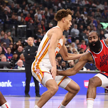 Jan 4, 2025; Inglewood, California, USA;  Los Angeles Clippers guard James Harden (1) dribbles the ball against Atlanta Hawks guard Dyson Daniels (5) during the first half at Intuit Dome. Mandatory Credit: Kiyoshi Mio-Imagn Images