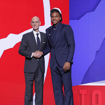 Jun 25, 2025; Brooklyn, NY, USA;  Collin Murray-Boyles stands with NBA commissioner Adam Silver after being selected as the ninth pick by the Toronto Raptors in the first round of the 2025 NBA Draft at Barclays Center. Mandatory Credit: Brad Penner-Imagn Images