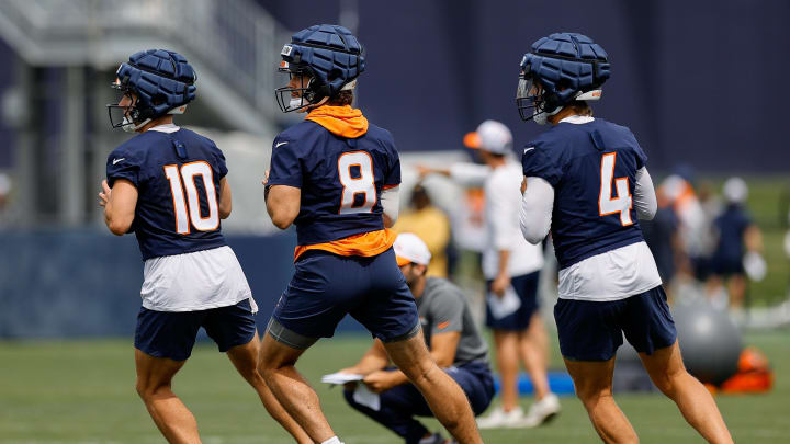 Jul 26, 2024; Englewood, CO, USA; Denver Broncos quarterback Bo Nix (10) and quarterback Jarrett Stidham (8) and quarterback Zach Wilson (4) during training camp at Broncos Park Powered by CommonSpirit. Mandatory Credit: Isaiah J. Downing-USA TODAY Sports