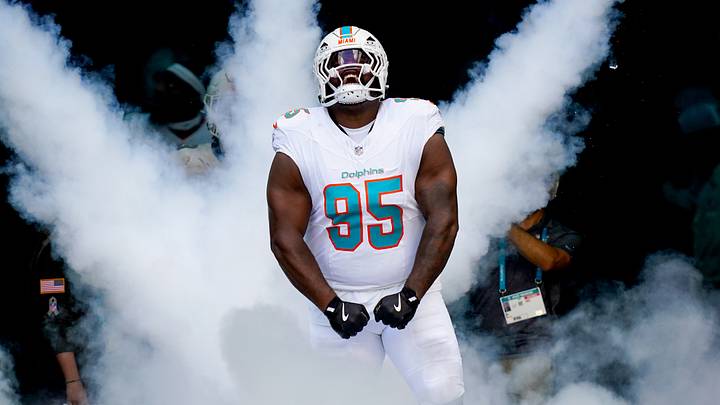 Former Miami Dolphins defensive tackle Benito Jones runs on the field before a game against the Buffalo Bills at Hard Rock Stadium. 