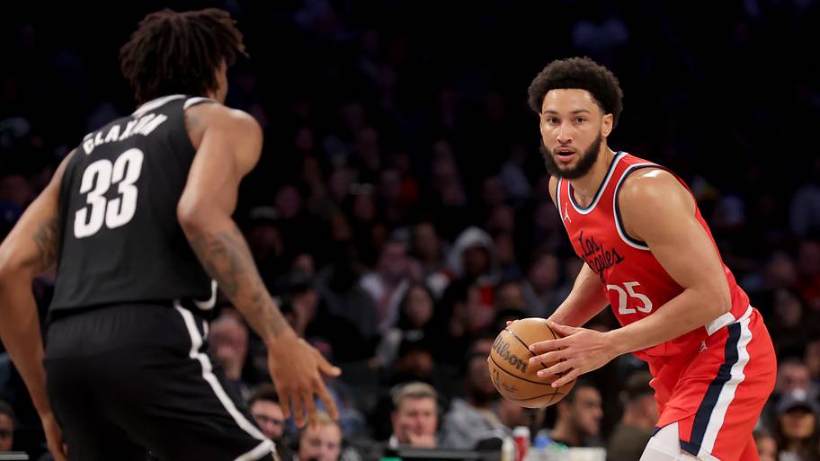 Los Angeles Clippers guard Ben Simmons (25) controls the ball against Brooklyn Nets center Nic Claxton.