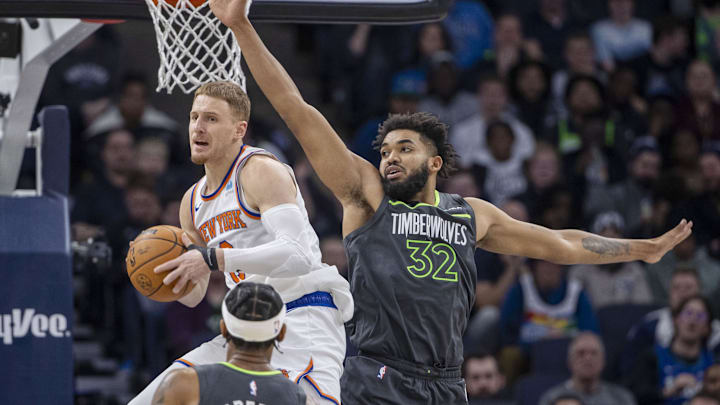 Nov 20, 2023; Minneapolis, Minnesota, USA; New York Knicks guard Donte DiVincenzo (0) looks to pass as Minnesota Timberwolves center Karl-Anthony Towns (32) defends in the second half at Target Center. Mandatory Credit: Jesse Johnson-Imagn Images Nov 20, 2023; Minneapolis, Minnesota, USA; New York Knicks guard Donte DiVincenzo (0) looks to pass as Minnesota Timberwolves center Karl-Anthony Towns (32) defends in the second half at Target Center. Mandatory Credit: Jesse Johnson-Imagn Images