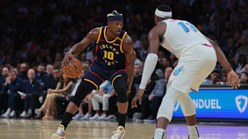 Mar 25, 2025; Miami, Florida, USA; Golden State Warriors forward Jimmy Butler III (10) dribbles the basketball as Miami Heat center Bam Adebayo (13) defends during the first quarter at Kaseya Center. Mandatory Credit: Sam Navarro-Imagn Images
