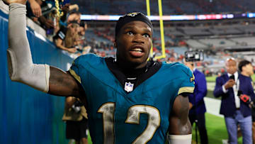 Jacksonville Jaguars wide receiver Travis Hunter (12) high-fives fans after the game of an NFL football matchup at EverBank Stadium, Monday, Oct. 6, 2025, in Jacksonville, Fla. The Jacksonville Jaguars edged the Kansas City Chiefs 31-28. [Corey Perrine/Florida Times-Union]