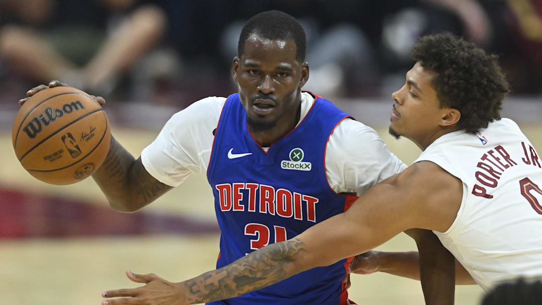 Oct 14, 2025; Cleveland, Ohio, USA; Detroit Pistons forward Javonte Green (0) dribbles beside Cleveland Cavaliers guard Craig Porter Jr. (9) in the second quarter at Rocket Arena.