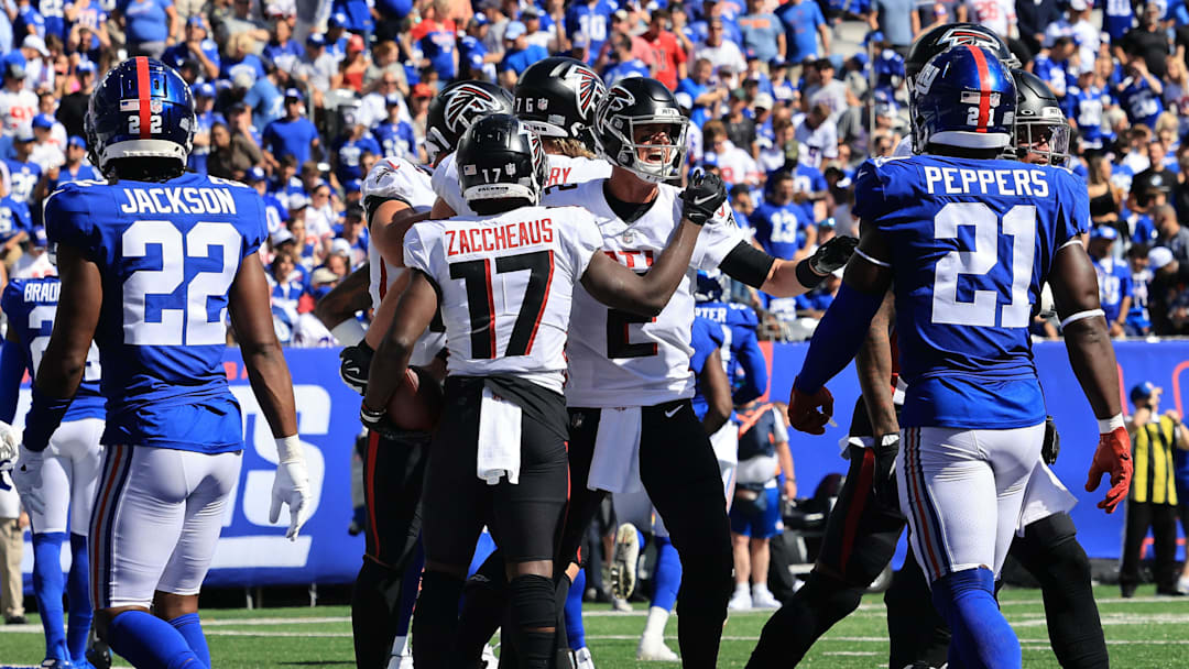 Sep 26, 2021; East Rutherford, New Jersey, USA; Atlanta Falcons wide receiver Olamide Zaccheaus (17) celebrates his touchdown with quarterback Matt Ryan (2) in front of New York Giants cornerback Adoree' Jackson (22) and free safety Jabrill Peppers (21) during the first quarter at MetLife Stadium. Mandatory Credit: Vincent Carchietta-Imagn Images