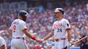 Jul 12, 2025; Minneapolis, Minnesota, USA; Minnesota Twins outfielder Trevor Larnach (9) celebrates his run with designated hitter Matt Wallner (38) against the Pittsburgh Pirates in the second inning at Target Field. Mandatory Credit: Brad Rempel-Imagn Images