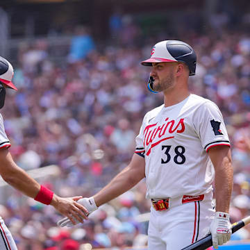 Jul 12, 2025; Minneapolis, Minnesota, USA; Minnesota Twins outfielder Trevor Larnach (9) celebrates his run with designated hitter Matt Wallner (38) against the Pittsburgh Pirates in the second inning at Target Field. Mandatory Credit: Brad Rempel-Imagn Images