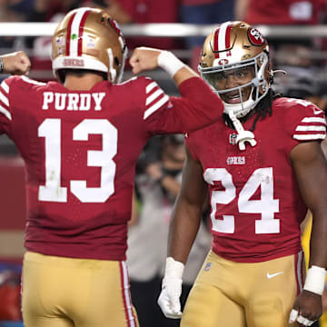 San Francisco 49ers teammates Jordan Mason, right, and Brock Purdy were both lightly recruited out of high school and unheralded out of college. 