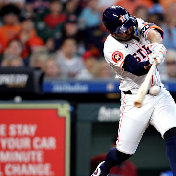 Sep 7, 2024; Houston, Texas, USA; Houston Astros second baseman Jose Altuve hits a double against the Arizona Diamondbacks.