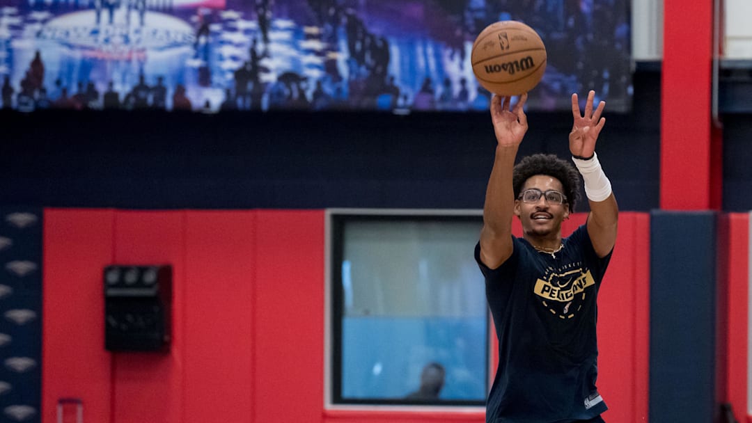 Sep 23, 2025; Metairie, LA, USA; New Orleans Pelicans guard Jordan Poole (3) shoots a half court shot during media day at Ochsner Sports Performance Center. Mandatory Credit: Matthew Hinton-Imagn Images