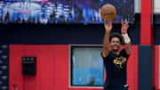 Sep 23, 2025; Metairie, LA, USA; New Orleans Pelicans guard Jordan Poole (3) shoots a half court shot during media day at Ochsner Sports Performance Center. Mandatory Credit: Matthew Hinton-Imagn Images