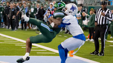 Nov 28, 2024; New Orleans, Louisiana, USA; Tulane Green Wave wide receiver Shazz Preston (6) scores a touchdown against Memphis Tigers defensive back Davion Ross (1) during the fourth quarter at Yulman Stadium. Mandatory Credit: Matthew Hinton-Imagn Images