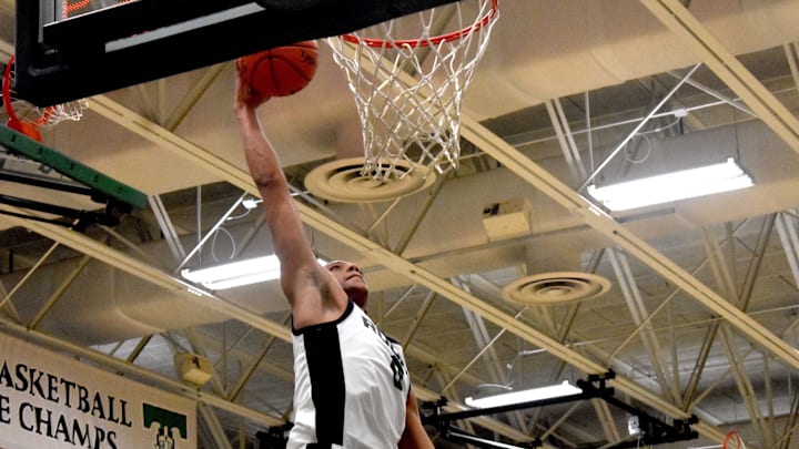 Trinity-Louisville senior forward Jayden Johnson dunks the ball in a game against Lexington Catholic Friday, Feb. 6, 2026.  Trinity is 3-0 in February and two of those wins were against ranked teams.