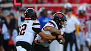 Oct 25, 2025; Lubbock, Texas, USA;  Oklahoma State Cowboys quarterback Noah Walters (12) hands the ball to running back Sesi Vailahi (3) in the second half during the game against the Texas Tech Red Raiders at Jones AT&T Stadium. Mandatory Credit: Michael C. Johnson-Imagn Images