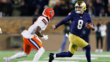Notre Dame quarterback Kenny Minchey (8) runs with the ball in the second half of a NCAA football game against Syracuse at Notre Dame Stadium on Saturday, Nov. 22, 2025, in South Bend.