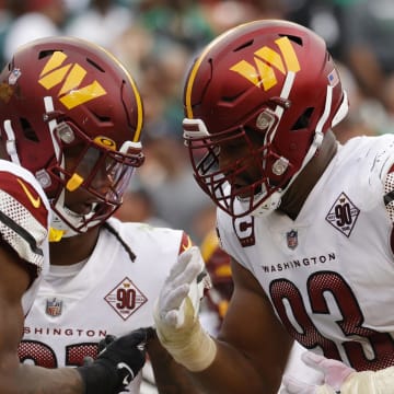 Sep 25, 2022; Landover, Maryland, USA; Washington Commanders defensive tackle Daron Payne (94) celebrates with Commanders defensive tackle Jonathan Allen (93) after a safety against the Philadelphia Eagles at FedExField. Mandatory Credit: Geoff Burke-USA TODAY Sports