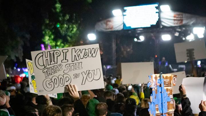 Signs poke fun at former Oregon Ducks head coach Chip Kelly during ESPN’s “College GameDay” Saturday, Oct. 11, 2024 on the campus of the University of Oregon in Eugene, Ore.