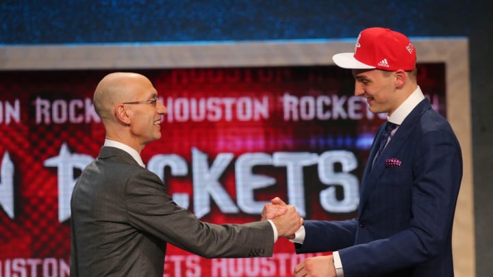 Jun 25, 2015; Brooklyn, NY, USA; Sam Dekker (Wisconsin) greets NBA commissioner Adam Silver after being selected as the number eighteen overall pick to the Houston Rockets in the first round of the 2015 NBA Draft at Barclays Center. Mandatory Credit: Brad Penner-USA TODAY Sports