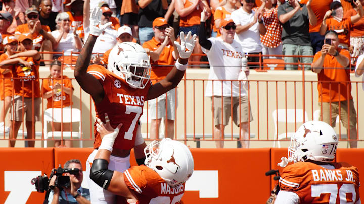 Aug 31, 2024; Austin, Texas, USA; Texas Longhorns wide receiver Isaiah Bond (7) and lineman Jake Majors (65) celebrate after a touchdown against the Colorado State Rams in the first half at Darrell K Royal-Texas Memorial Stadium. Mandatory Credit: Aaron Meullion-Imagn Images Aug 31, 2024; Austin, Texas, USA; Texas Longhorns wide receiver Isaiah Bond (7) and lineman Jake Majors (65) celebrate after a touchdown against the Colorado State Rams in the first half at Darrell K Royal-Texas Memorial Stadium. Mandatory Credit: Aaron Meullion-Imagn Images