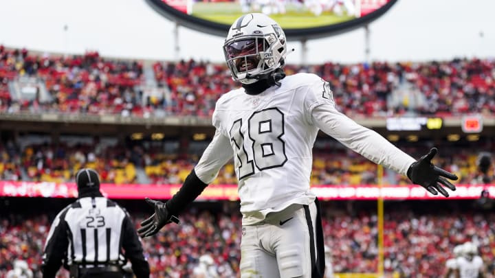 Dec 25, 2023; Kansas City, Missouri, USA; Las Vegas Raiders cornerback Jack Jones (18) interacts with then crowd during the second half against the Kansas City Chiefs at GEHA Field at Arrowhead Stadium. Mandatory Credit: Jay Biggerstaff-USA TODAY Sports