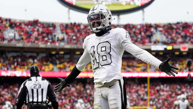 Las Vegas Raiders cornerback Jack Jones (18) interacts with then crowd during the second half of a game against the Chiefs.