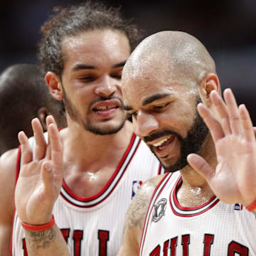 May 26, 2011; Chicago, IL, USA; Chicago Bulls forward Carlos Boozer (right) reacts after being called for a foul against Miami Heat forward LeBron James (not pictured) during the second half in game five of the eastern conference finals of the 2011 NBA playoffs at the United Center. Mandatory Credit: Mike DiNovo-Imagn Images