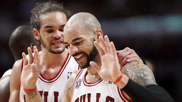 May 26, 2011; Chicago, IL, USA; Chicago Bulls forward Carlos Boozer (right) reacts after being called for a foul against Miami Heat forward LeBron James (not pictured) during the second half in game five of the eastern conference finals of the 2011 NBA playoffs at the United Center. Mandatory Credit: Mike DiNovo-Imagn Images May 26, 2011; Chicago, IL, USA; Chicago Bulls forward Carlos Boozer (right) reacts after being called for a foul against Miami Heat forward LeBron James (not pictured) during the second half in game five of the eastern conference finals of the 2011 NBA playoffs at the United Center. Mandatory Credit: Mike DiNovo-Imagn Images
