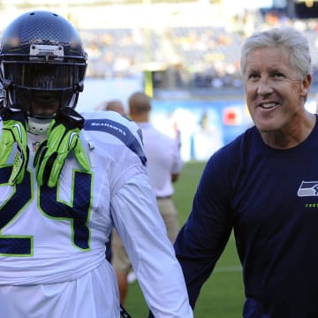 Aug. 8, 2013; San Diego, CA; Seattle Seahawks running back Marshawn Lynch (24) and head coach Pete Carroll prior to the game against the San Diego Chargers at Qualcomm Stadium.