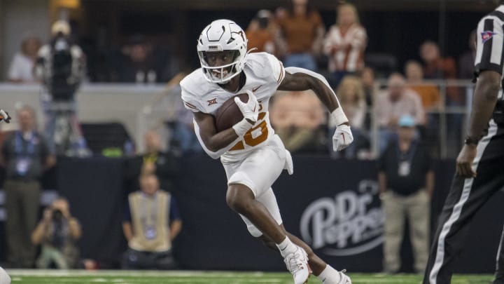 Dec 2, 2023; Arlington, TX, USA; Texas Longhorns running back Quintrevion Wisner (26) in action during the game between the Texas Longhorns and the Oklahoma State Cowboys at AT&T Stadium. Mandatory Credit: Jerome Miron-USA TODAY Sports