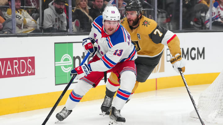 Jan 18, 2024; Las Vegas, Nevada, USA; New York Rangers left wing Alexis Lafreniere (13) skates ahead of Vegas Golden Knights defenseman Alex Pietrangelo (7) during the first period at T-Mobile Arena. Mandatory Credit: Stephen R. Sylvanie-USA TODAY Sports