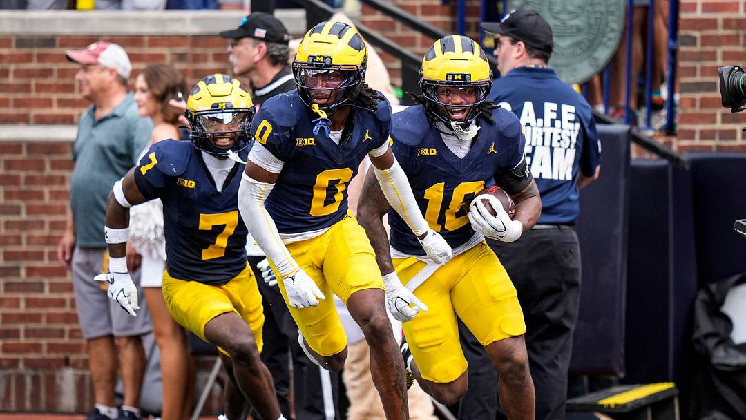 Michigan cornerback Jyaire Hill (0), center, celebrates an interception against Oklahoma with cornerback Zeke Berry (10), and safety Chris Bracy (7) during the second half at Michigan Stadium in Ann Arbor on Saturday, Sept. 12, 2026. Michigan cornerback Jyaire Hill (0), center, celebrates an interception against Oklahoma with cornerback Zeke Berry (10), and safety Chris Bracy (7) during the second half at Michigan Stadium in Ann Arbor on Saturday, Sept. 12, 2026.