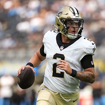 Aug 10, 2025; Inglewood, California, USA; New Orleans Saints quarterback Spencer Rattler (2) scrambles during the first quarter against the Los Angeles Chargers at SoFi Stadium. Mandatory Credit: Jon Endow-Imagn Images