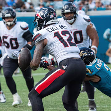 Jacksonville Jaguars cornerback Tyson Campbell (3) strips the ball from Houston Texans wide receiver Nico Collins (12) during the fourth quarter between the Houston Texans and the Jacksonville Jaguars Sunday September 21, 2025 at EverBank Stadium in Jacksonville, Fla. The Jaguars defeated the Texans 17-10. [Doug Engle/Florida Times-Union]