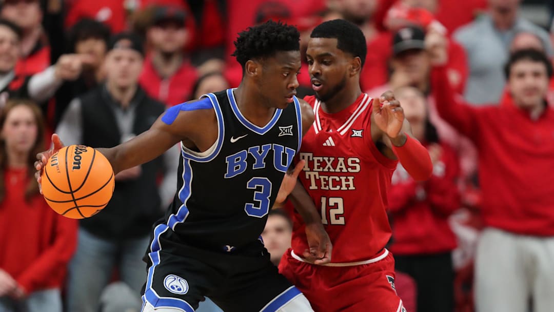 Jan 17, 2026; Lubbock, Texas, USA;  BYU Cougars forward AJ Dybantsa (3) works the ball against Texas Tech Red Raiders guard Donovan Atwell (12) in the first half at United Supermarkets Arena. Mandatory Credit: Michael C. Johnson-Imagn Images