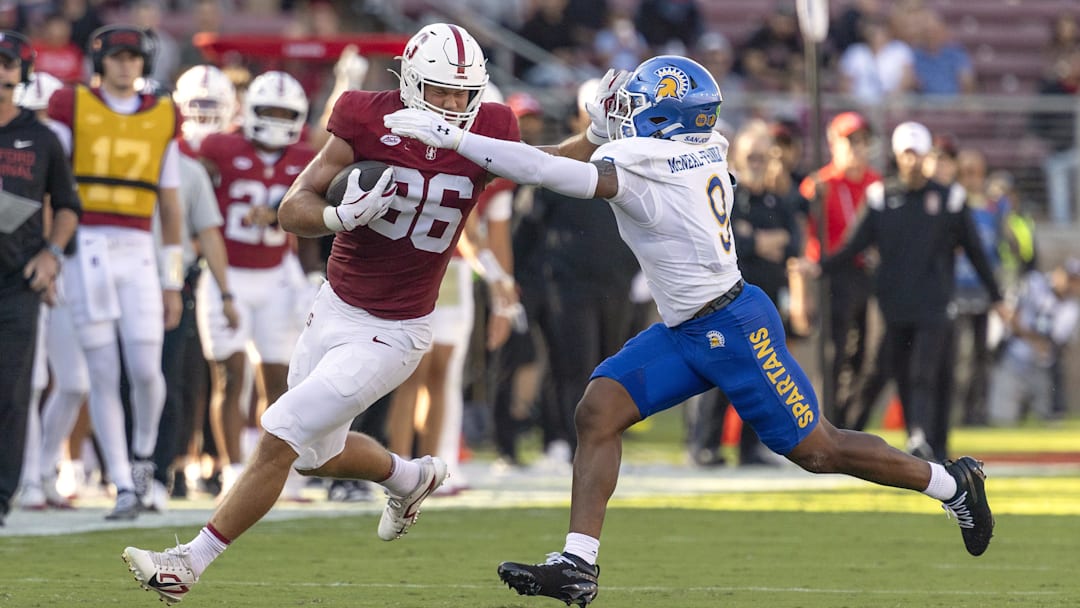 Sep 27, 2025; Stanford, California, USA;  Stanford Cardinal tight end Sam Roush (86) stiff arms San Jose State Spartans linebacker Noah McNeal-Franklin (9) during the first quarter at Stanford Stadium. Mandatory Credit: Stan Szeto-Imagn Images

